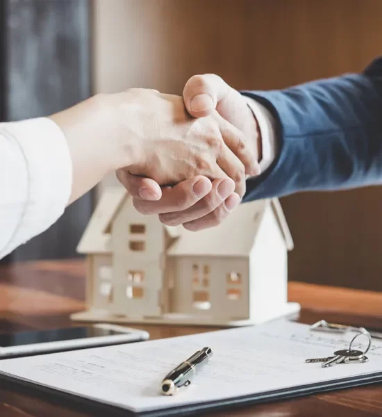 A handshake over a purchase of a home